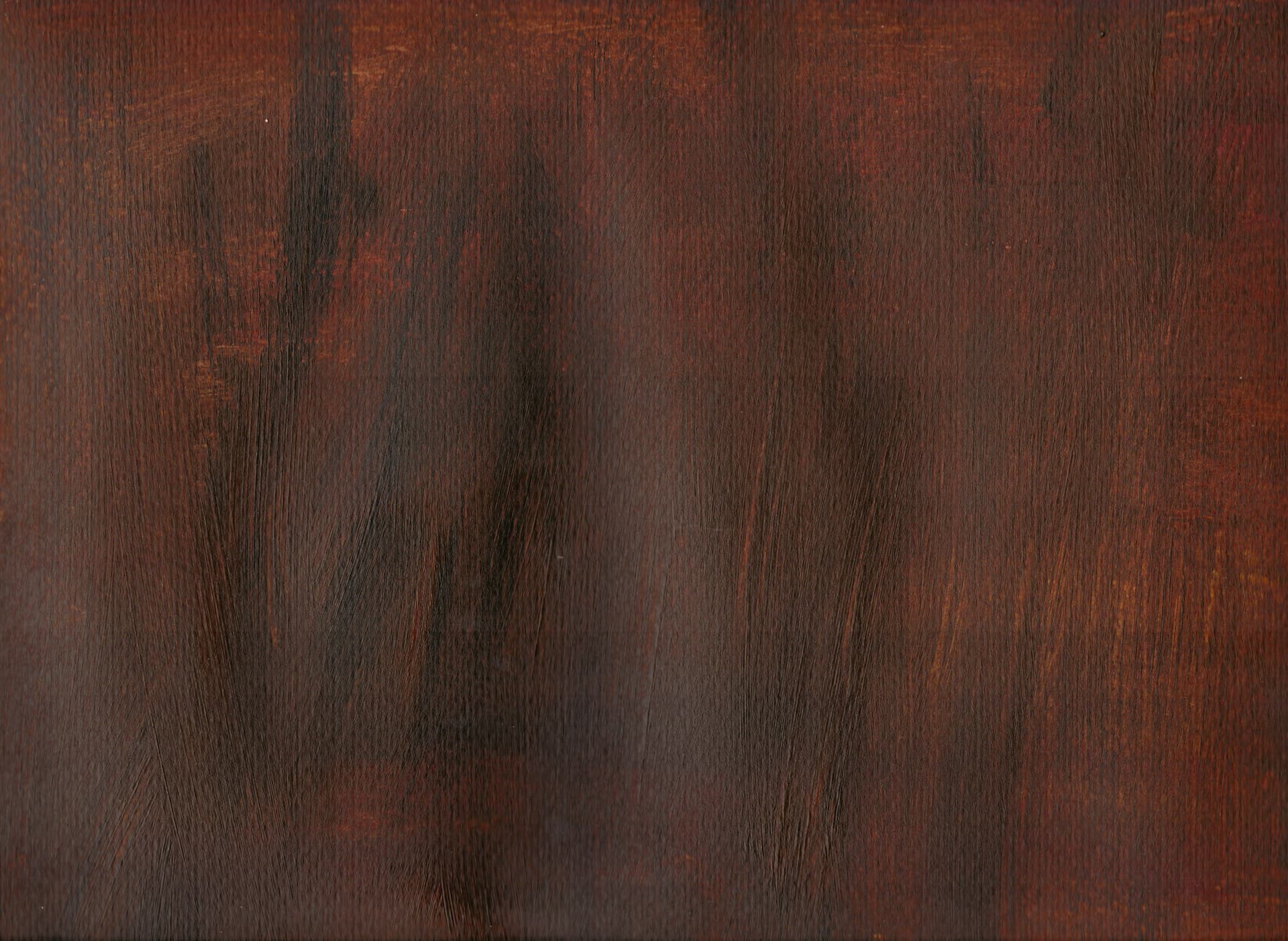 Close-up of dark stained wood with pronounced grain running across the frame